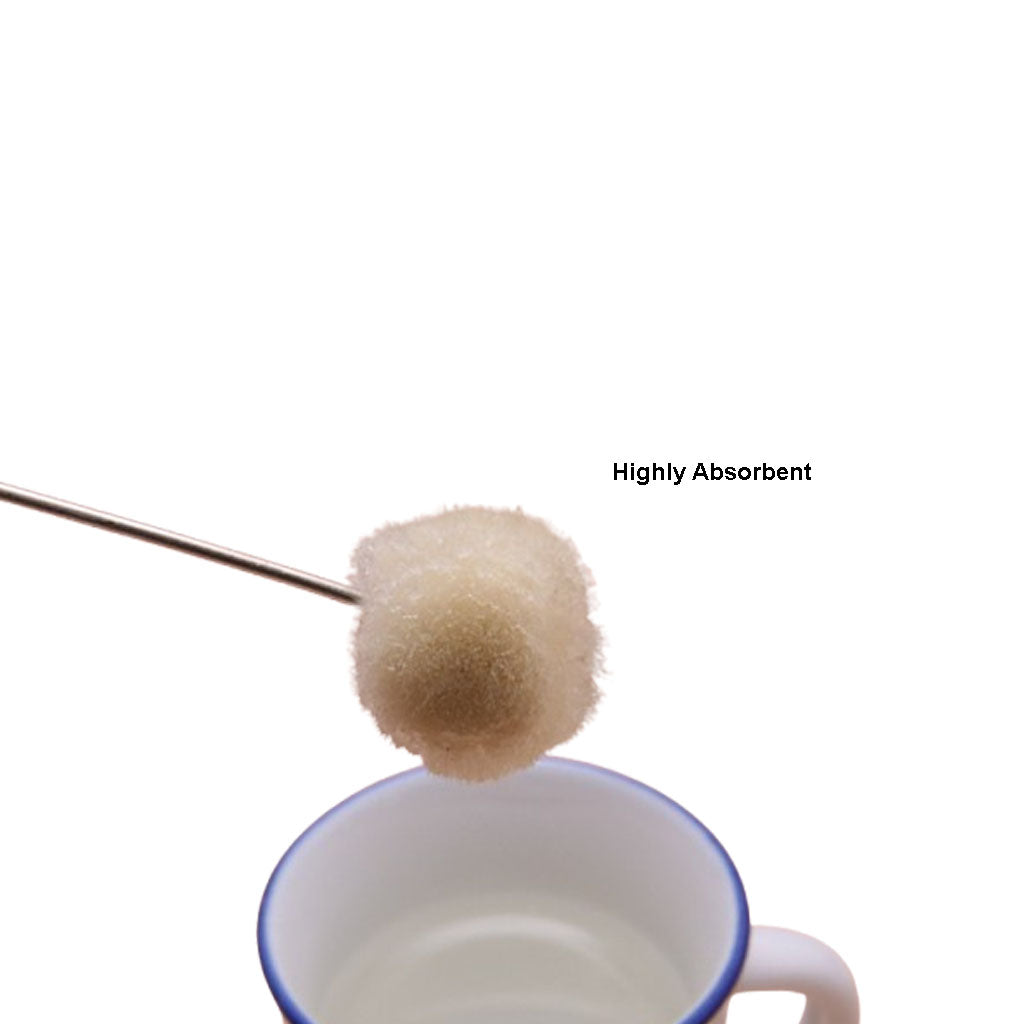 Cleaning reusable wool dauber in warm soapy water after leather dye application
