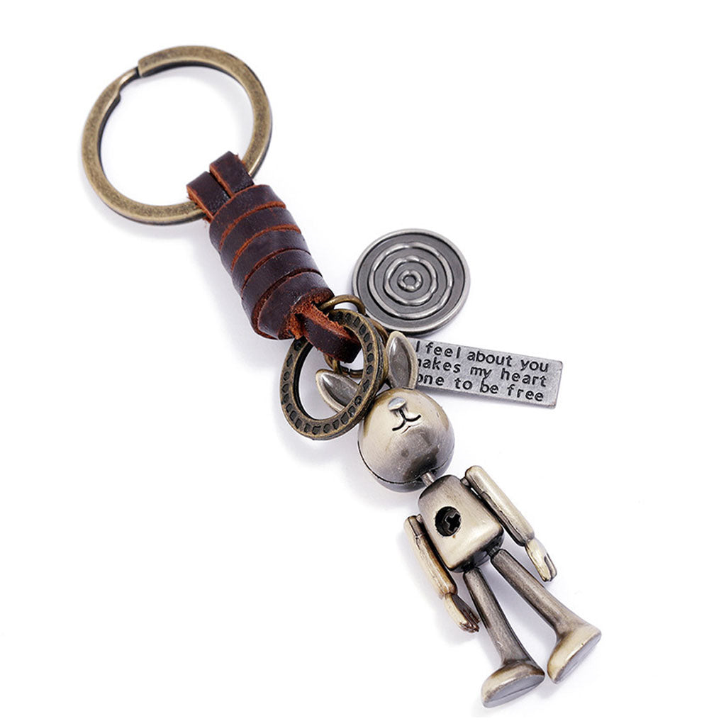 Handmade rabbit leather keychain with punk details, antique finish, and inspirational engraved message.
