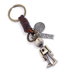 Handmade rabbit leather keychain with punk details, antique finish, and inspirational engraved message.