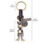 Handmade rabbit leather keychain with punk details, antique finish, and inspirational engraved message.